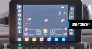 Touchscreen display of the Uni-Touch® interface in a vehicle, featuring various icons for controls and diagnostics, with a speed indicator showing 0.0 mph.